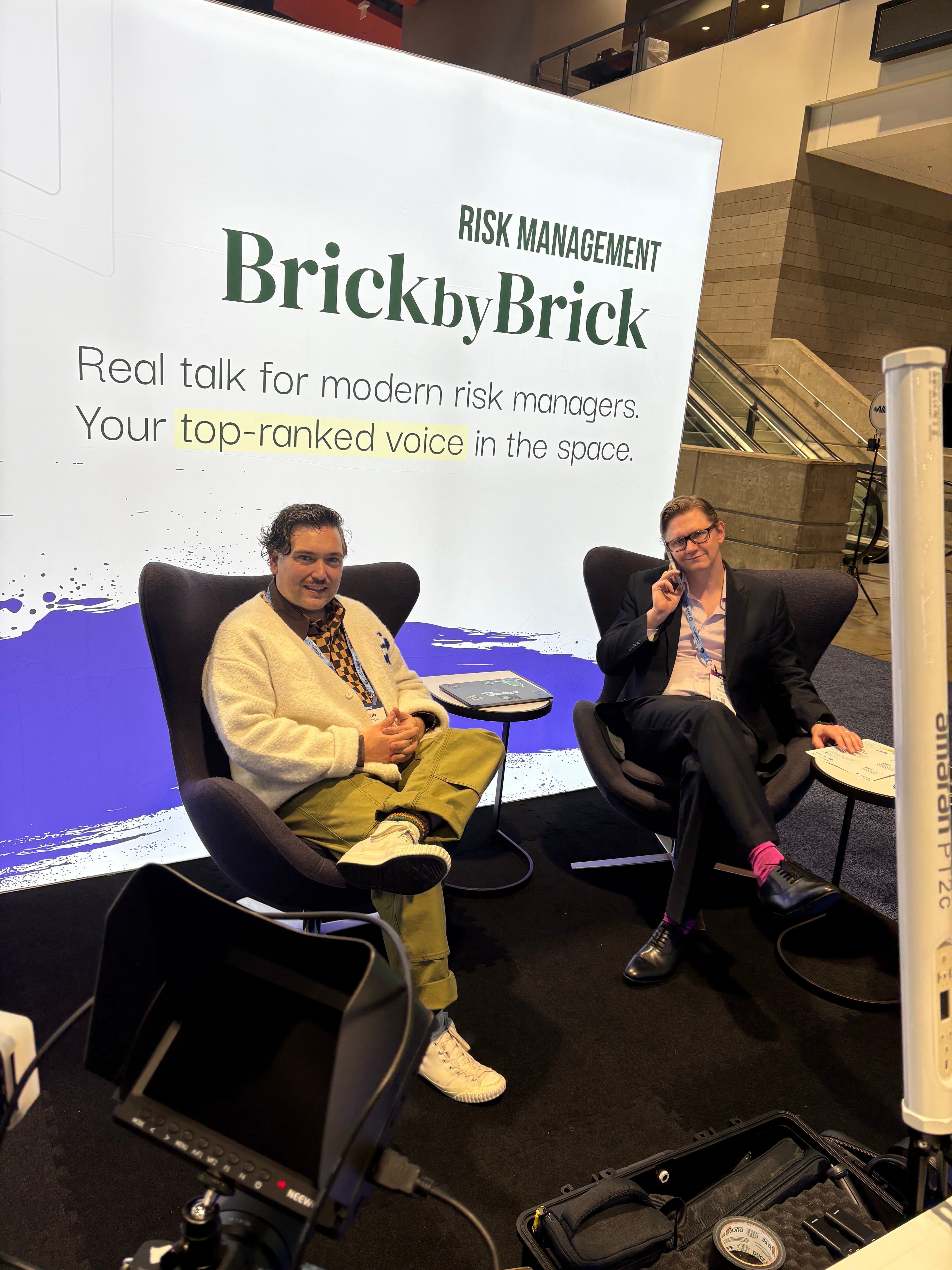 Jason and guest recording at conference booth